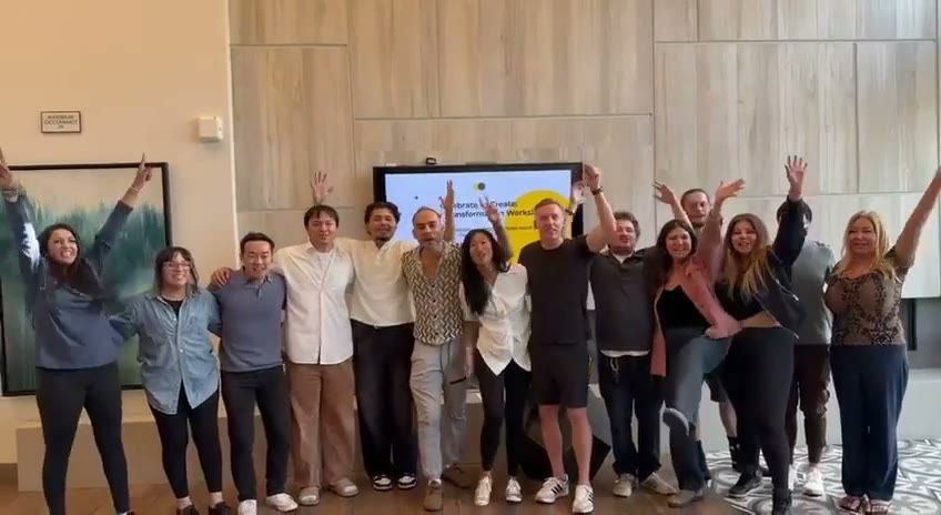 The whole group from the last Decision Room, cheering together