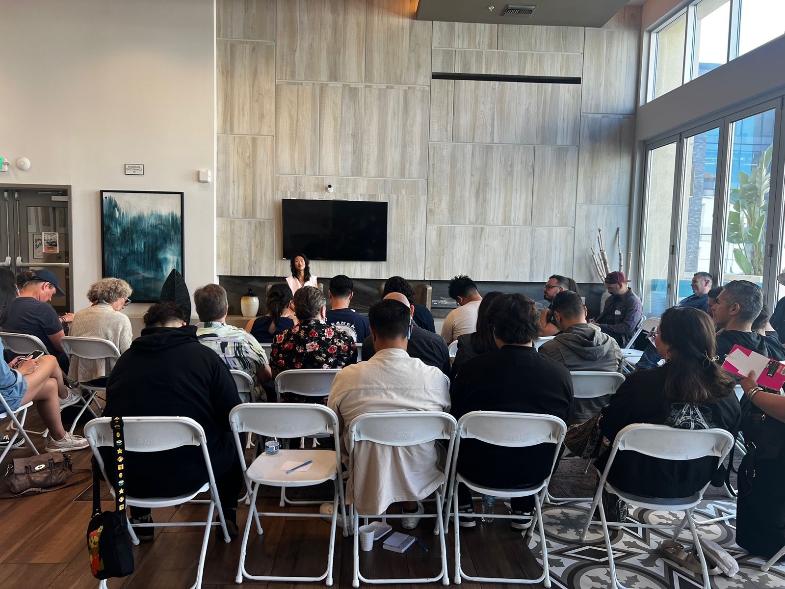 Participants gathered in The Decision Room, viewed from the back